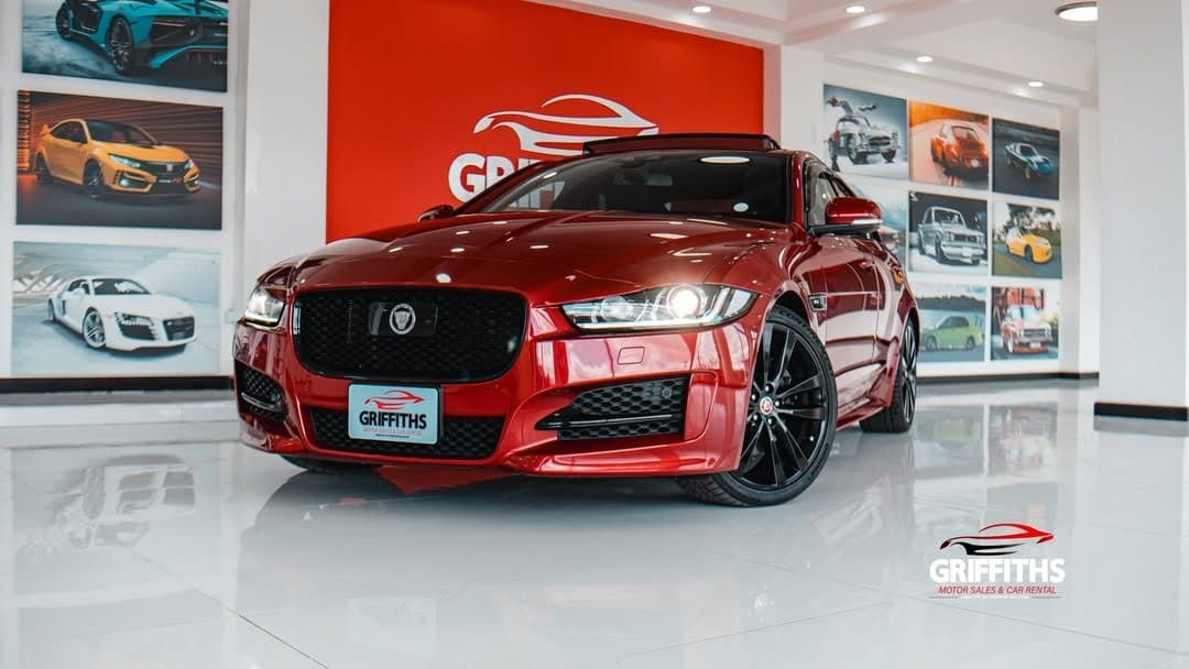 Red Jaguar on the Griffiths Motor Sales showroom floor